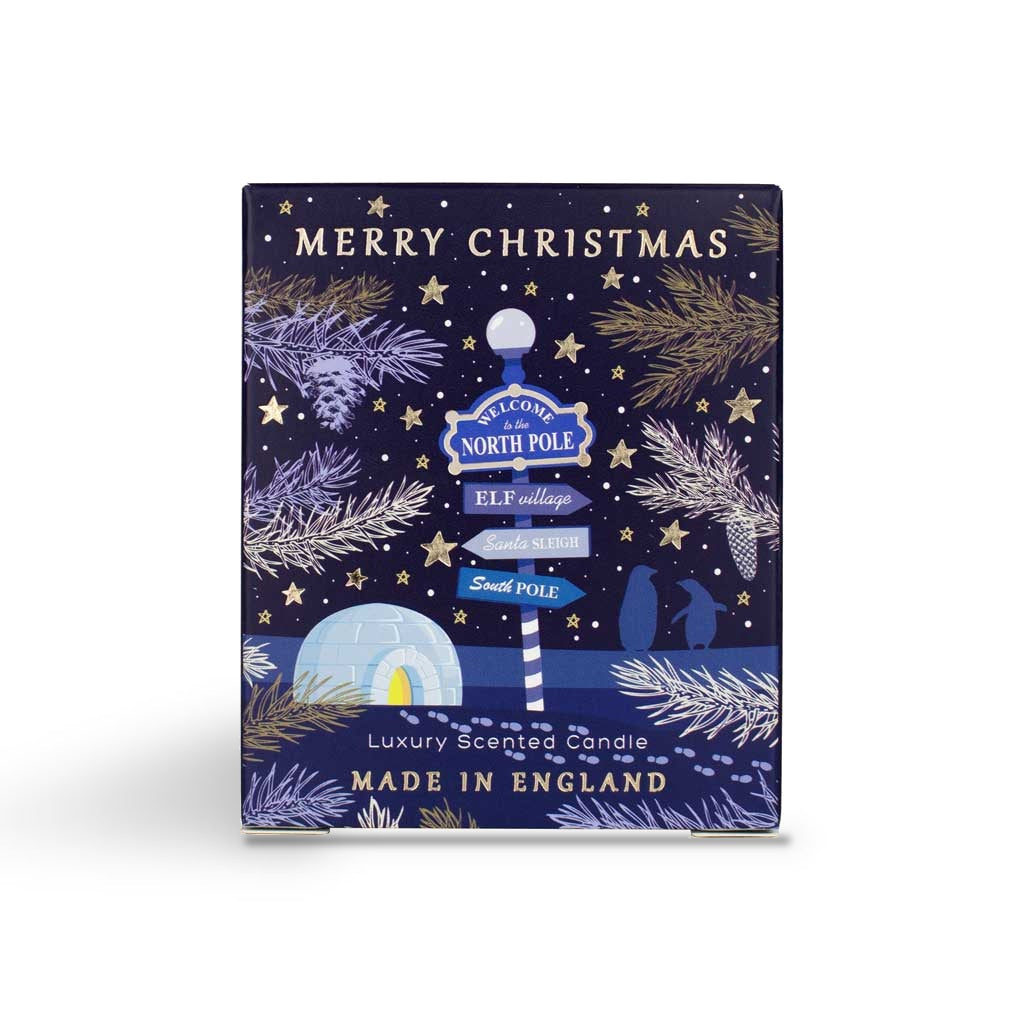 North Pole scented candle box with a snowy signpost design