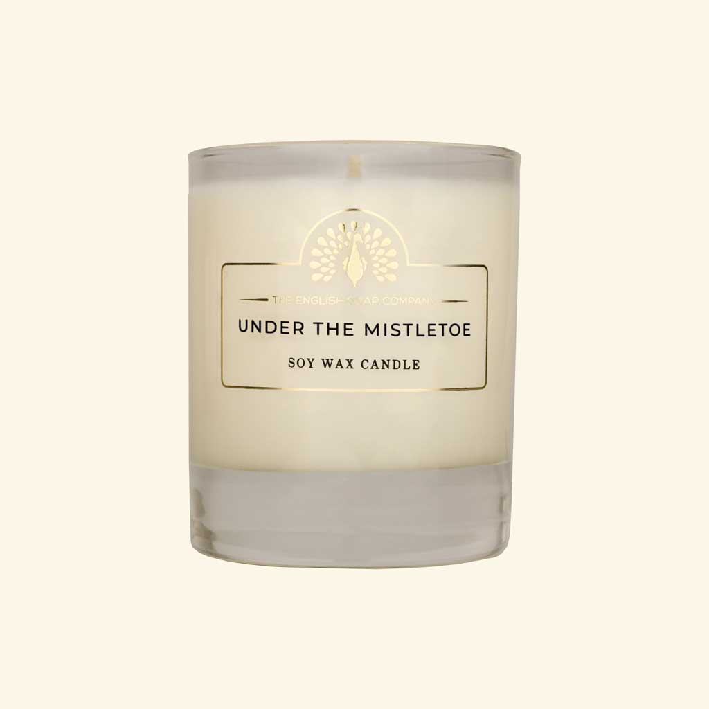 Under the Mistletoe candle in a glass jar