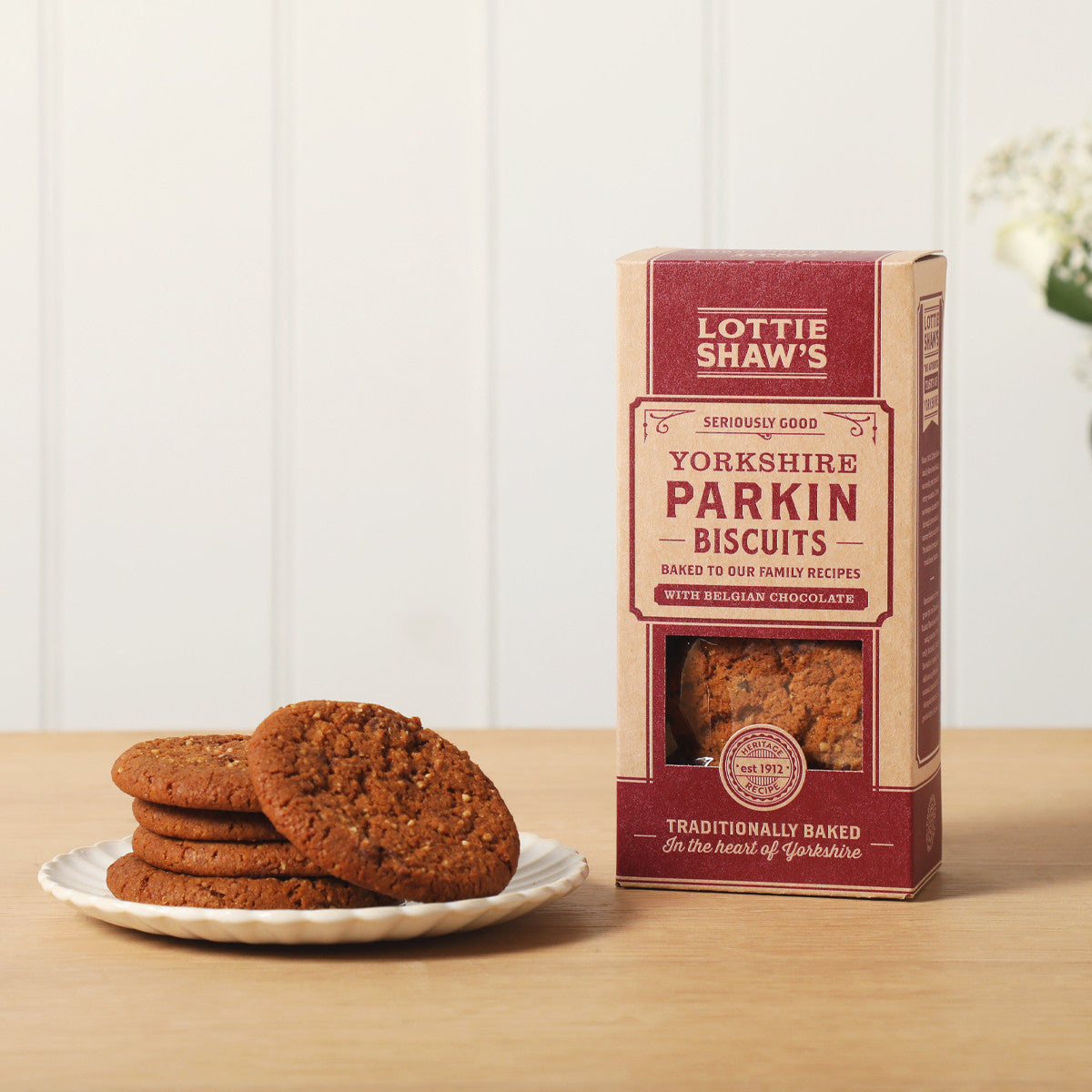 Yorkshire Parkin Biscuits box with a plate of the ginger biscuits