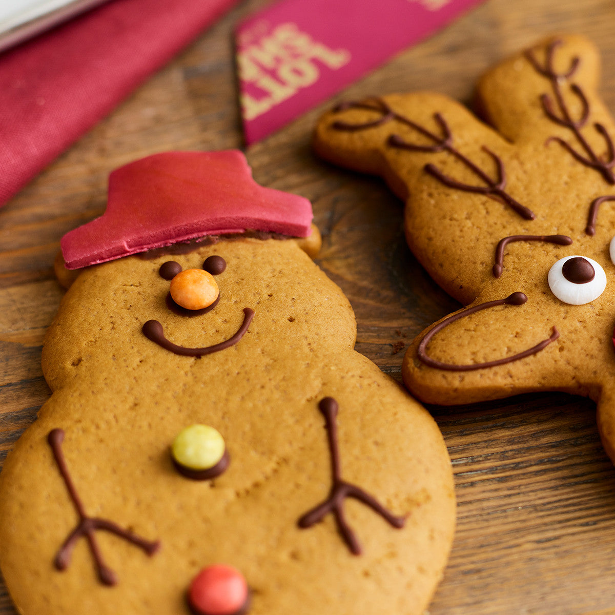 Gingerbread snowmen decorated with chocolate and sugar shells