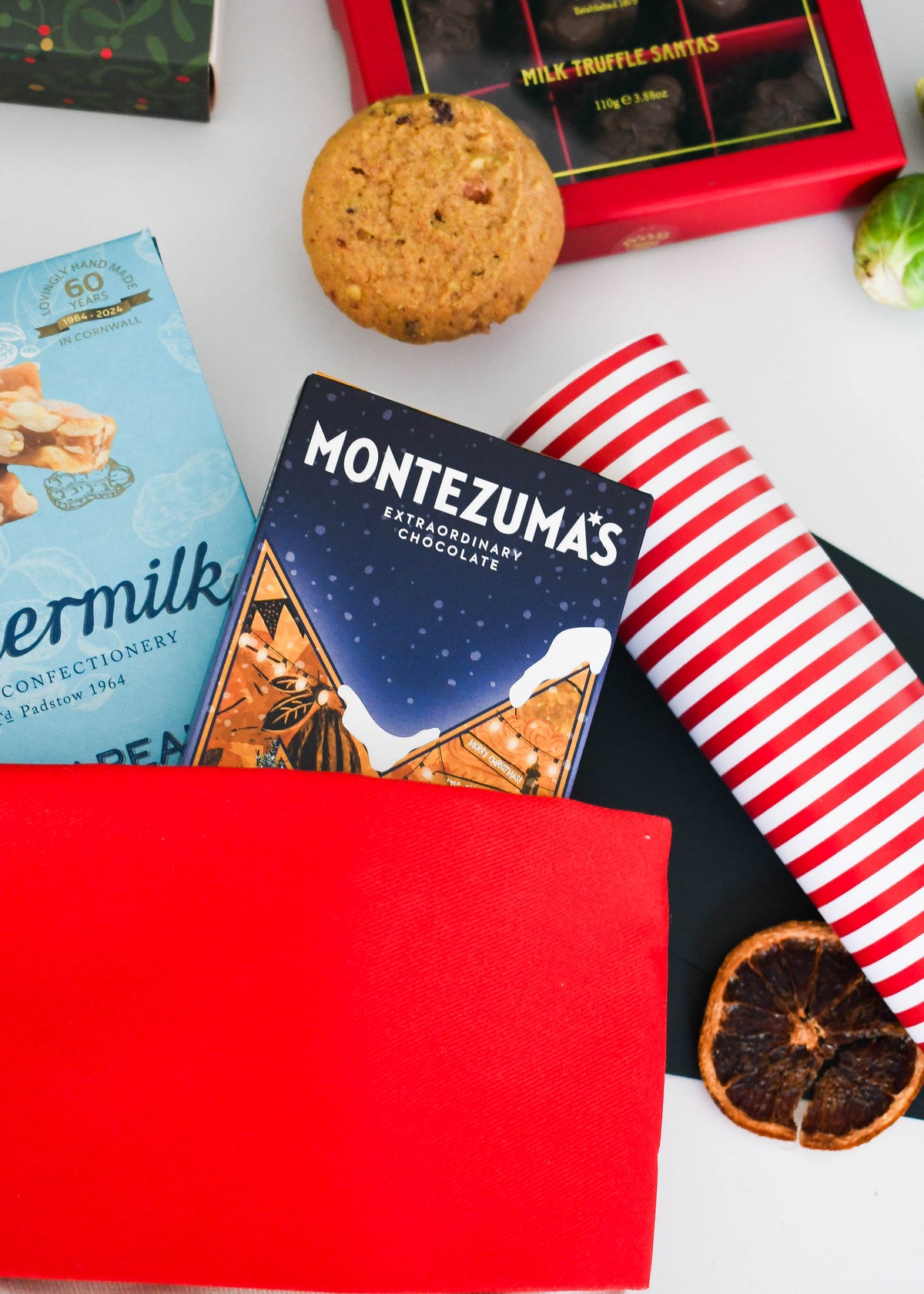 Montezuma's chocolate and Buttermilk peanut brittle tucked into the red cuff of the stocking