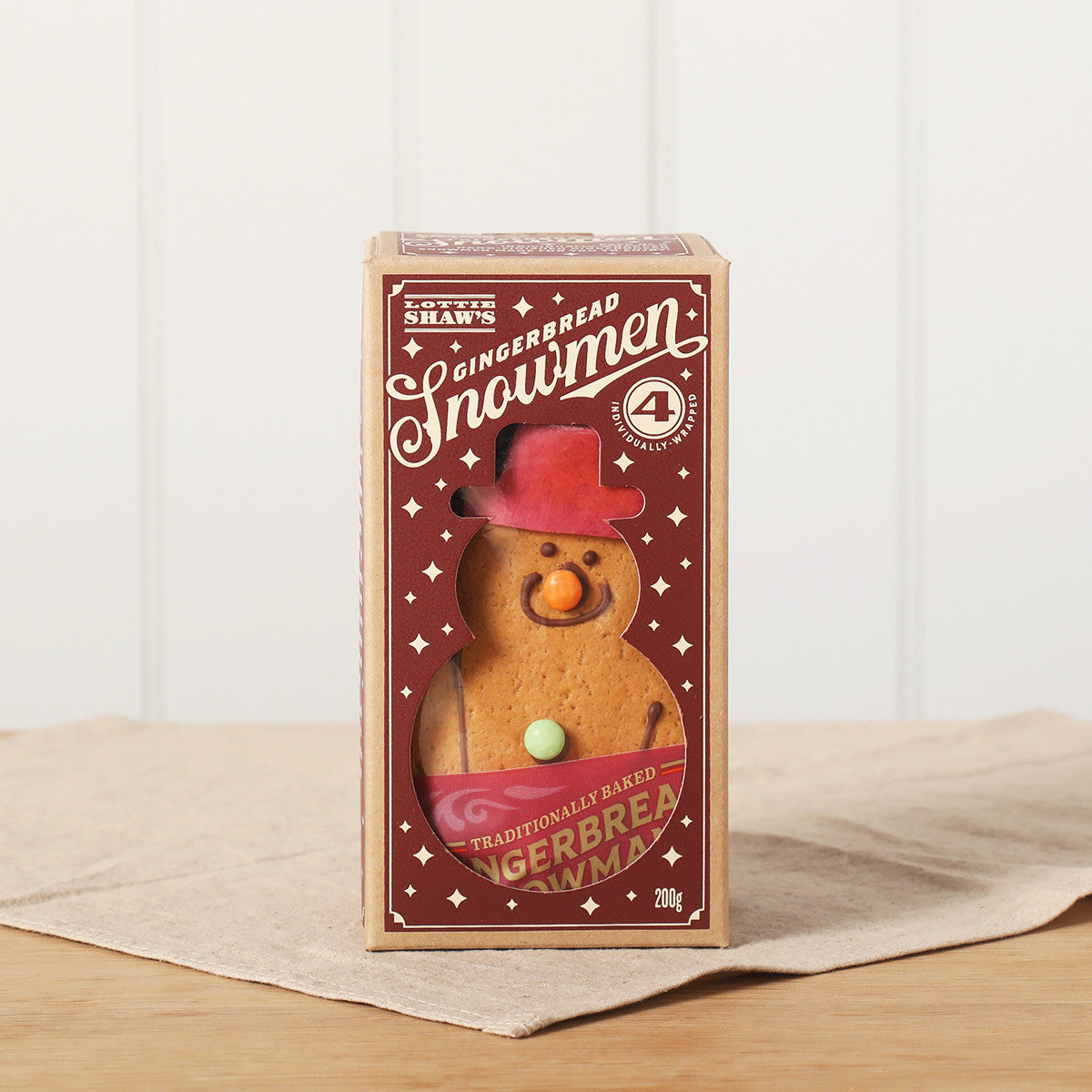 Box of four Lottie Shaw's gingerbread snowmen
