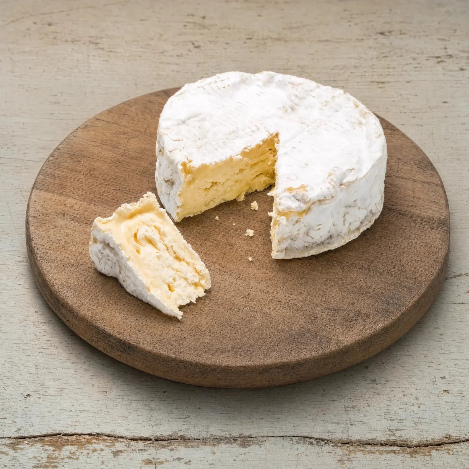 Baron Bigod soft cheese on a cheese board, English cheesemonger counter