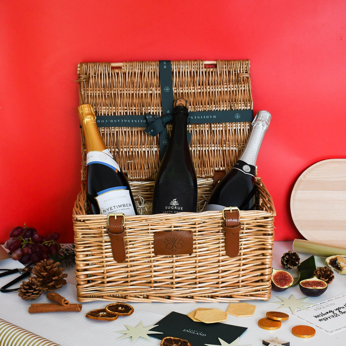 English Sparkling Wine Trio Christmas hamper against a red background