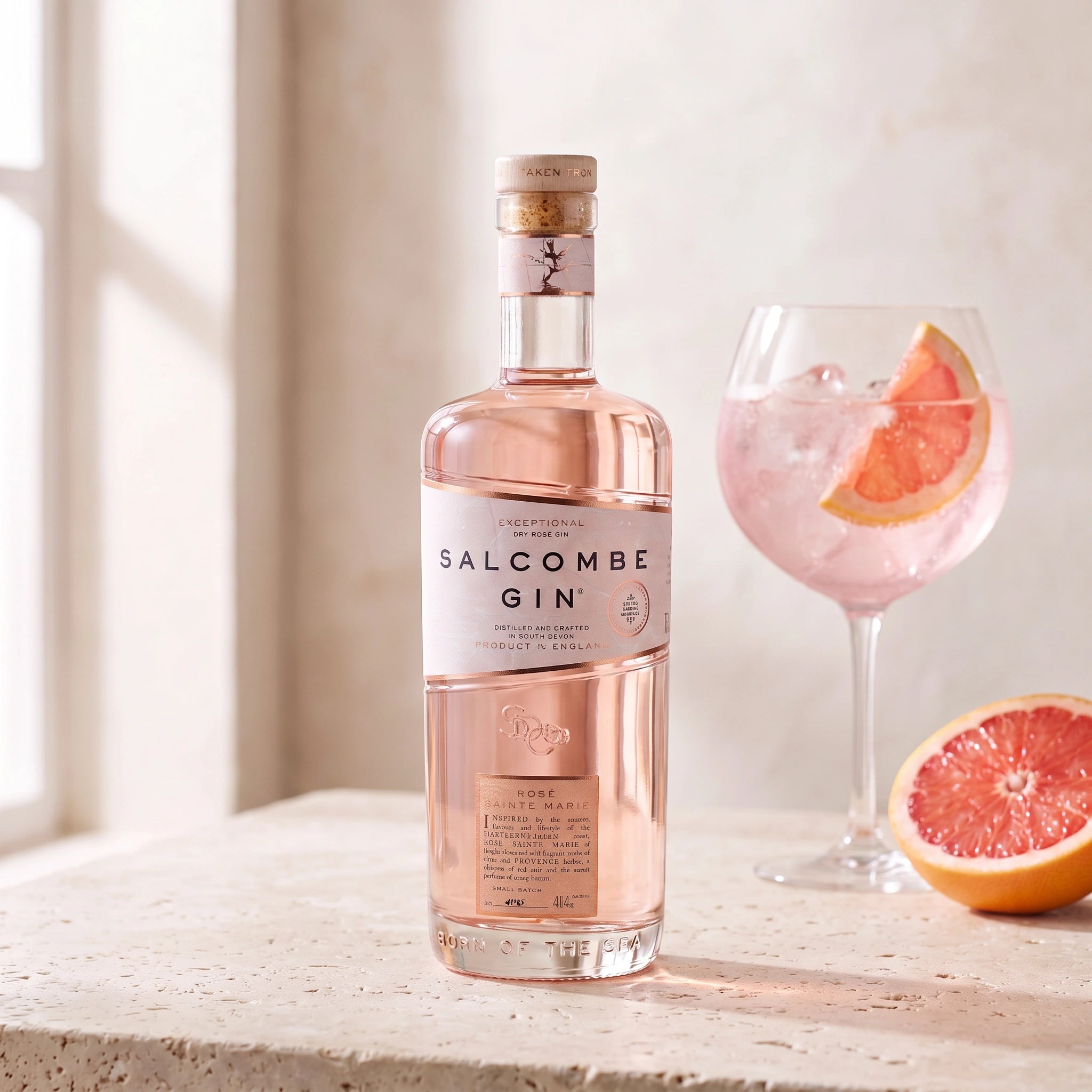 Salcombe Gin Rosé Sainte Marie bottle with a pink gin and tonic serve
