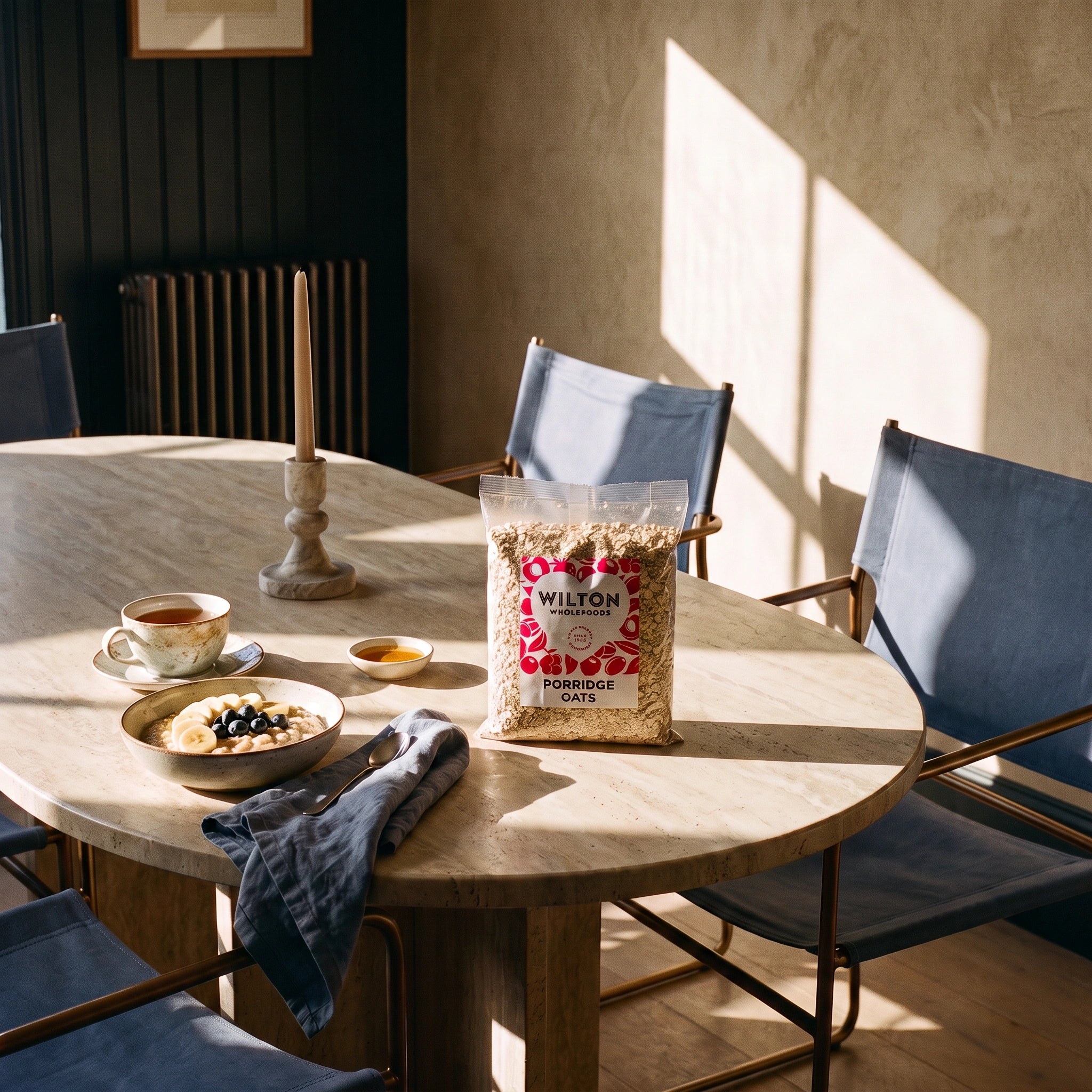 Wilton Porridge Oats 500g bag on a sunlit marble dining table breakfast setting