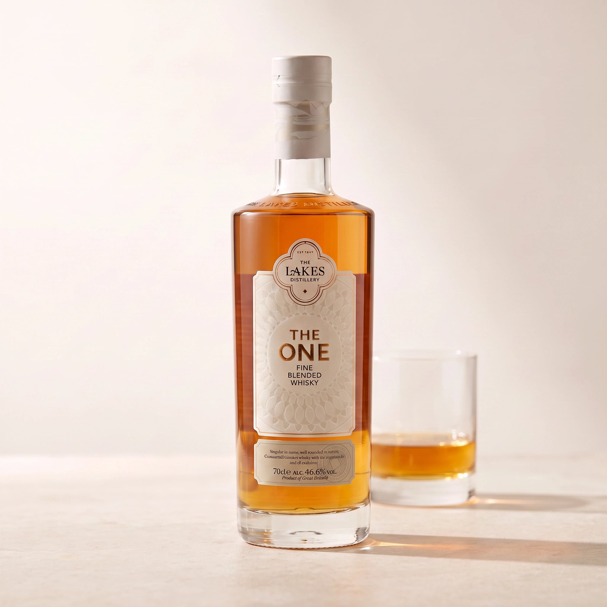 The One Fine Blended Whisky bottle with a glass of whisky