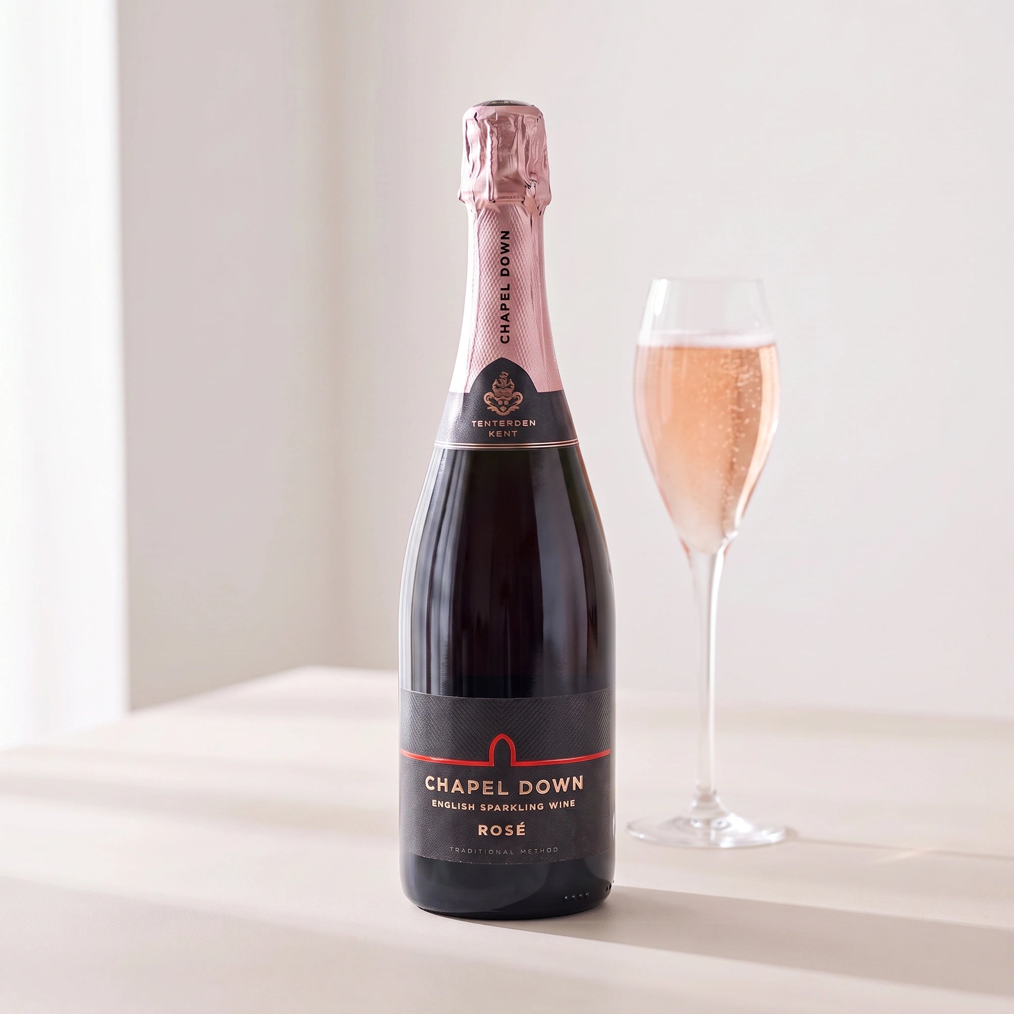 Chapel Down English Rosé bottle with a glass of sparkling rosé