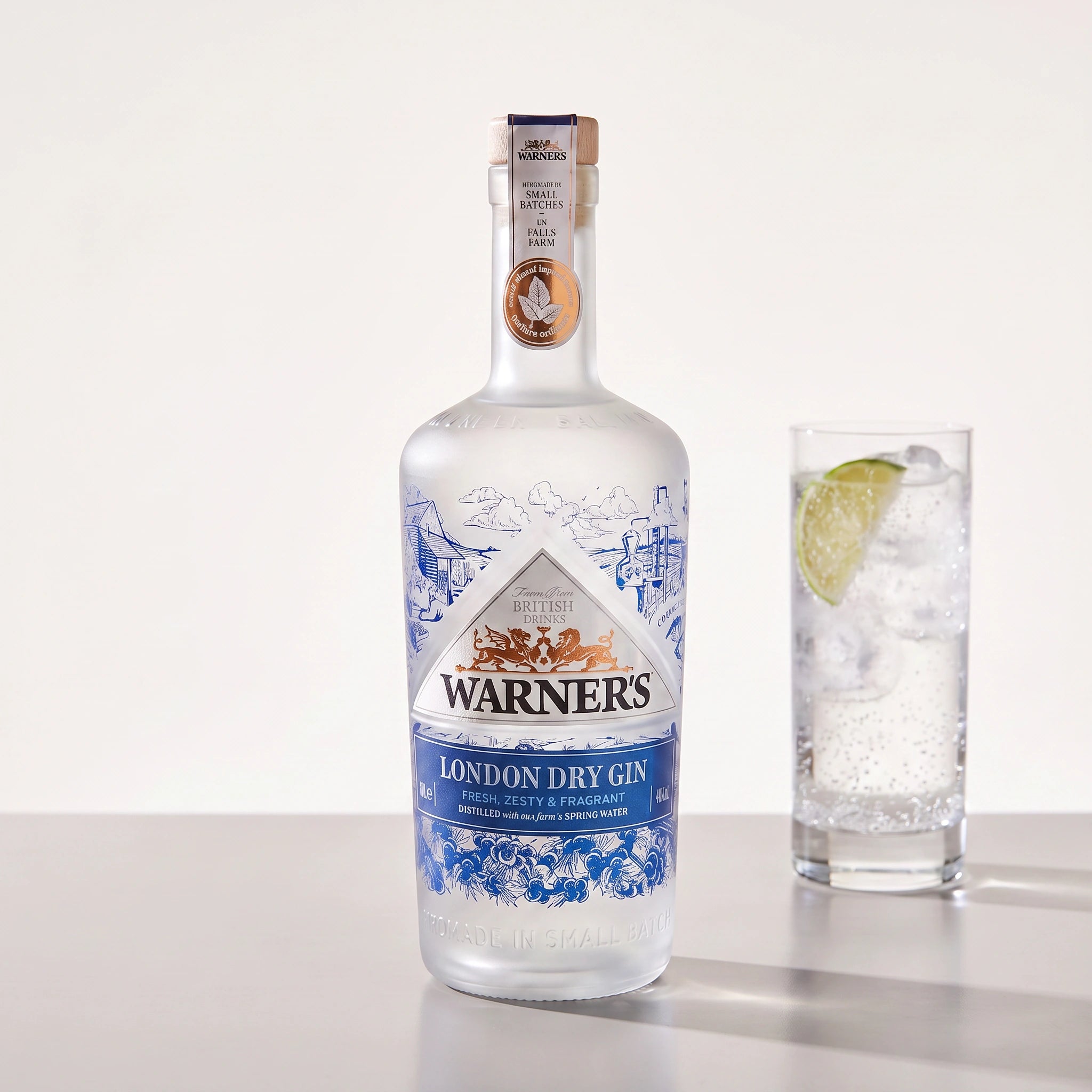 Warner's London Dry Gin bottle with a gin and tonic serve