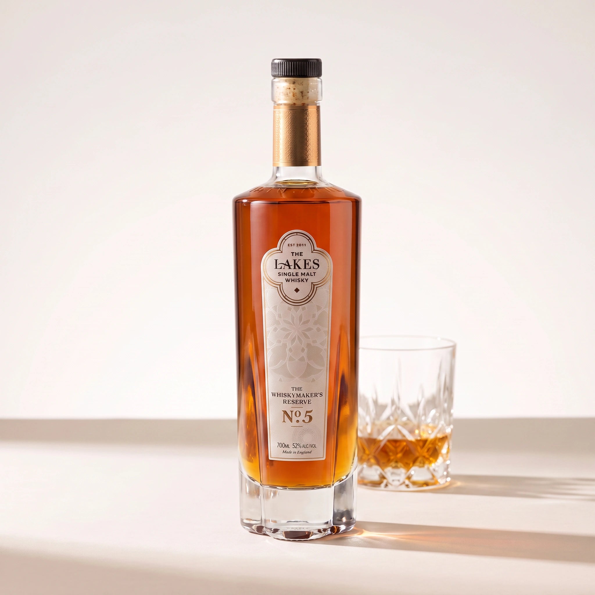 The Lakes Whiskymaker's Reserve No.5 bottle with a glass of whisky