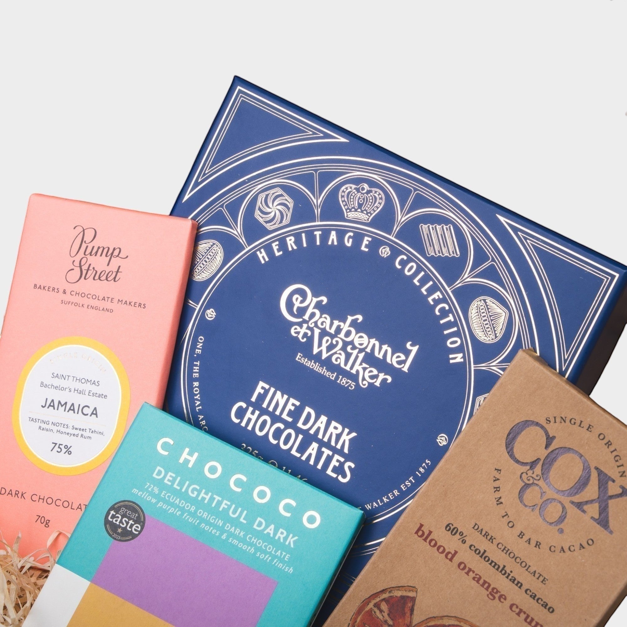 Made In England Artisan Chocolate Selection Gift Hamper with dark chocolate bars and Charbonnel et Walker fine chocolates in a woven basket.