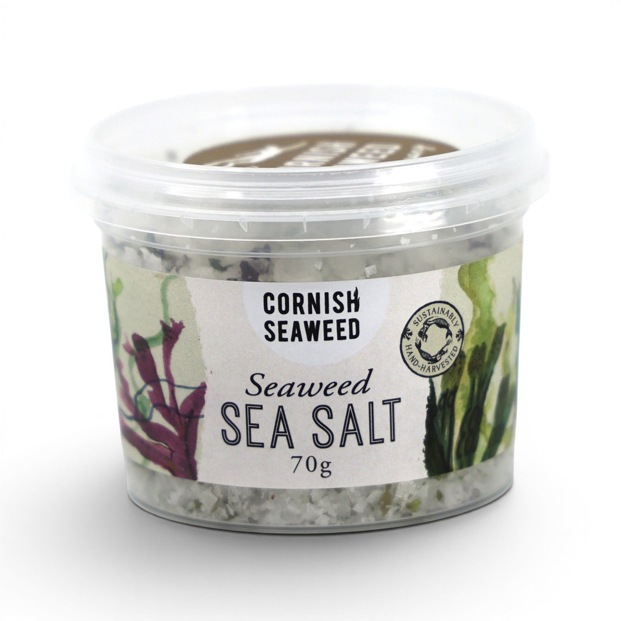 Made In England Cornish Sea Salt and Mixed Seaweed Flakes in a clear tub with a label featuring seaweed illustrations and text.