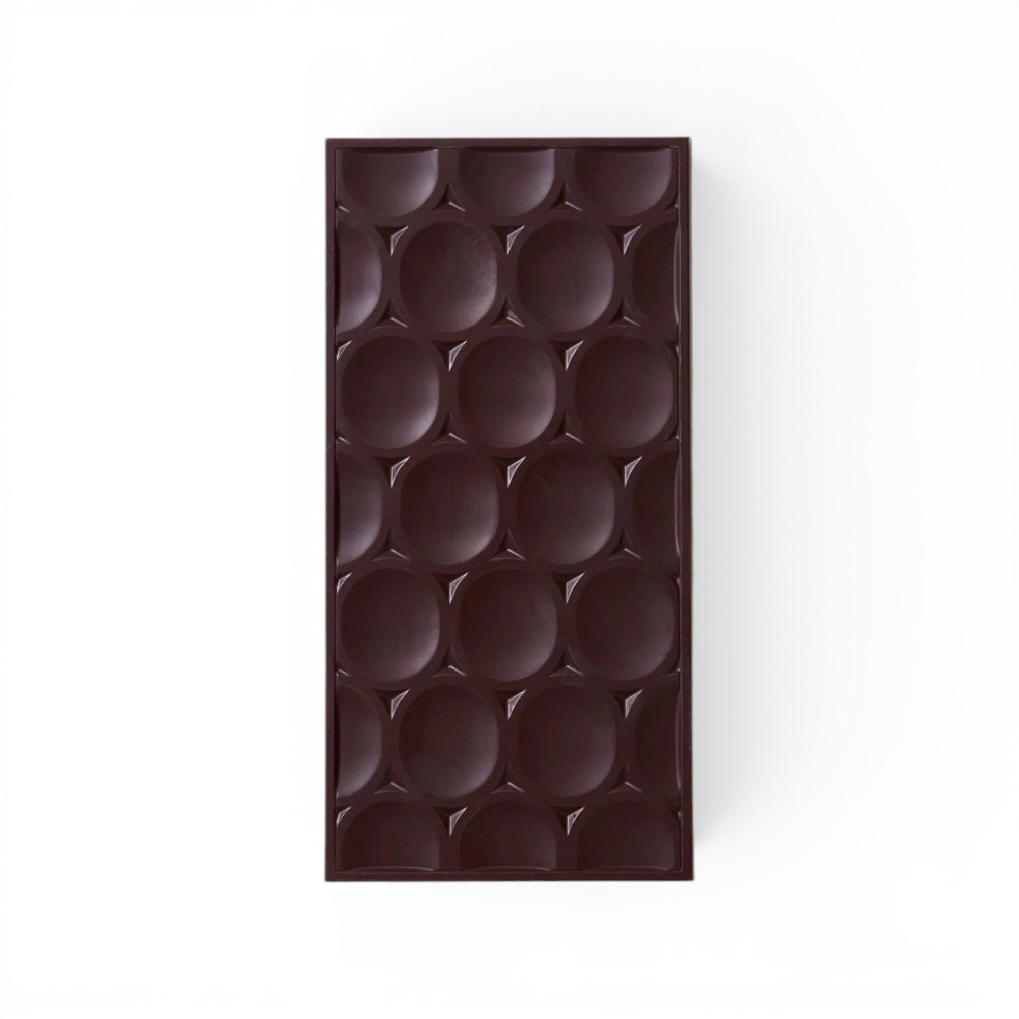 Made In England 75% Dark Chocolate Single Origin Jamaica Bar with circular indentations.
