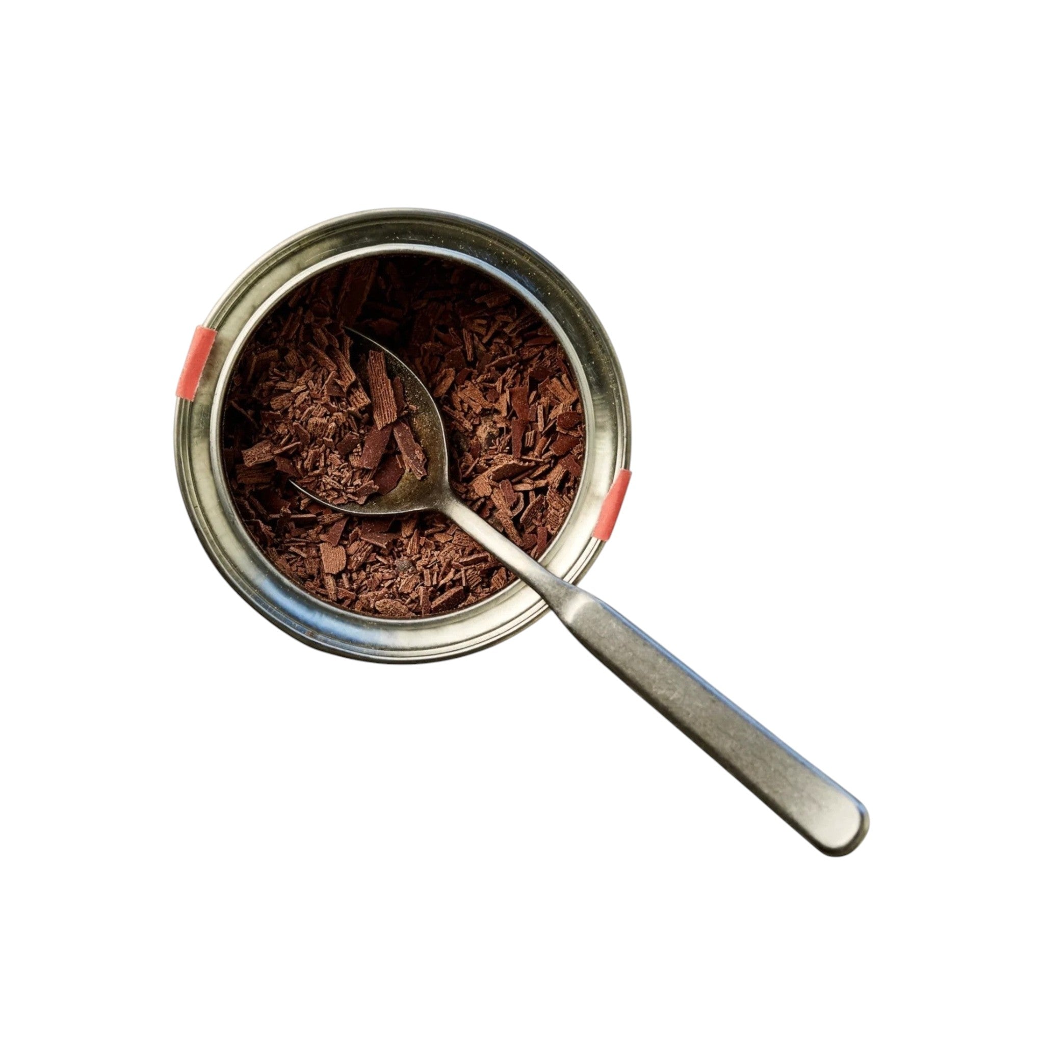 Made In England West Papua 70% drinking chocolate shavings in a tin with a spoon.