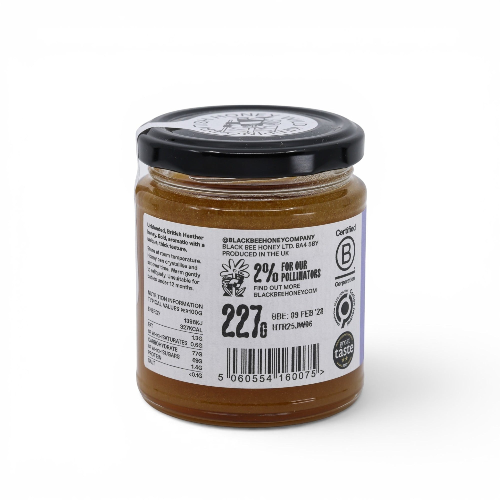 Made In England jar of unblended British heather honey, thick texture, amber colour, with nutritional information and certifications on the label.