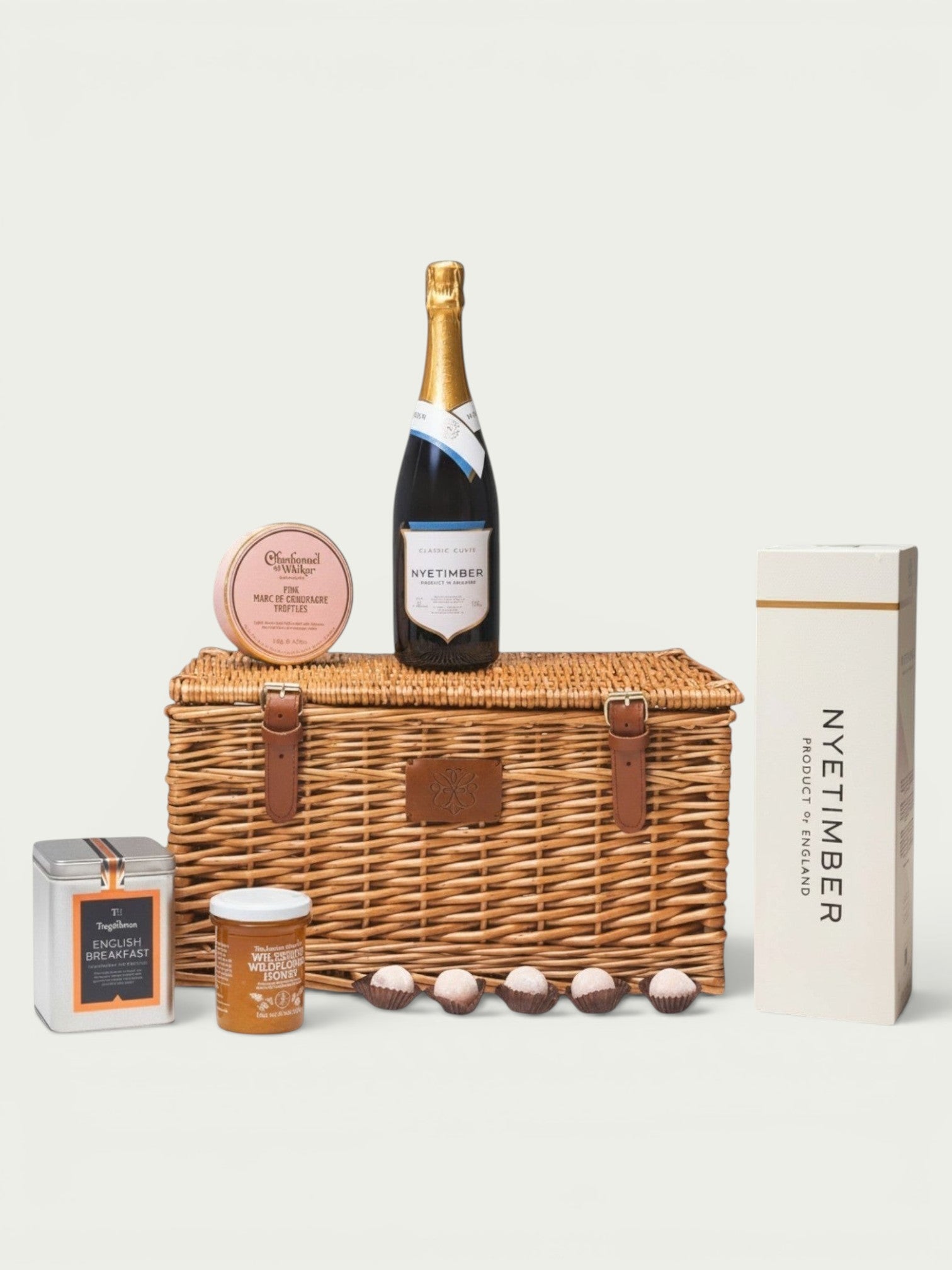 Made In England luxury picnic hamper with Nyetimber sparkling wine, truffles, tea, and honey.