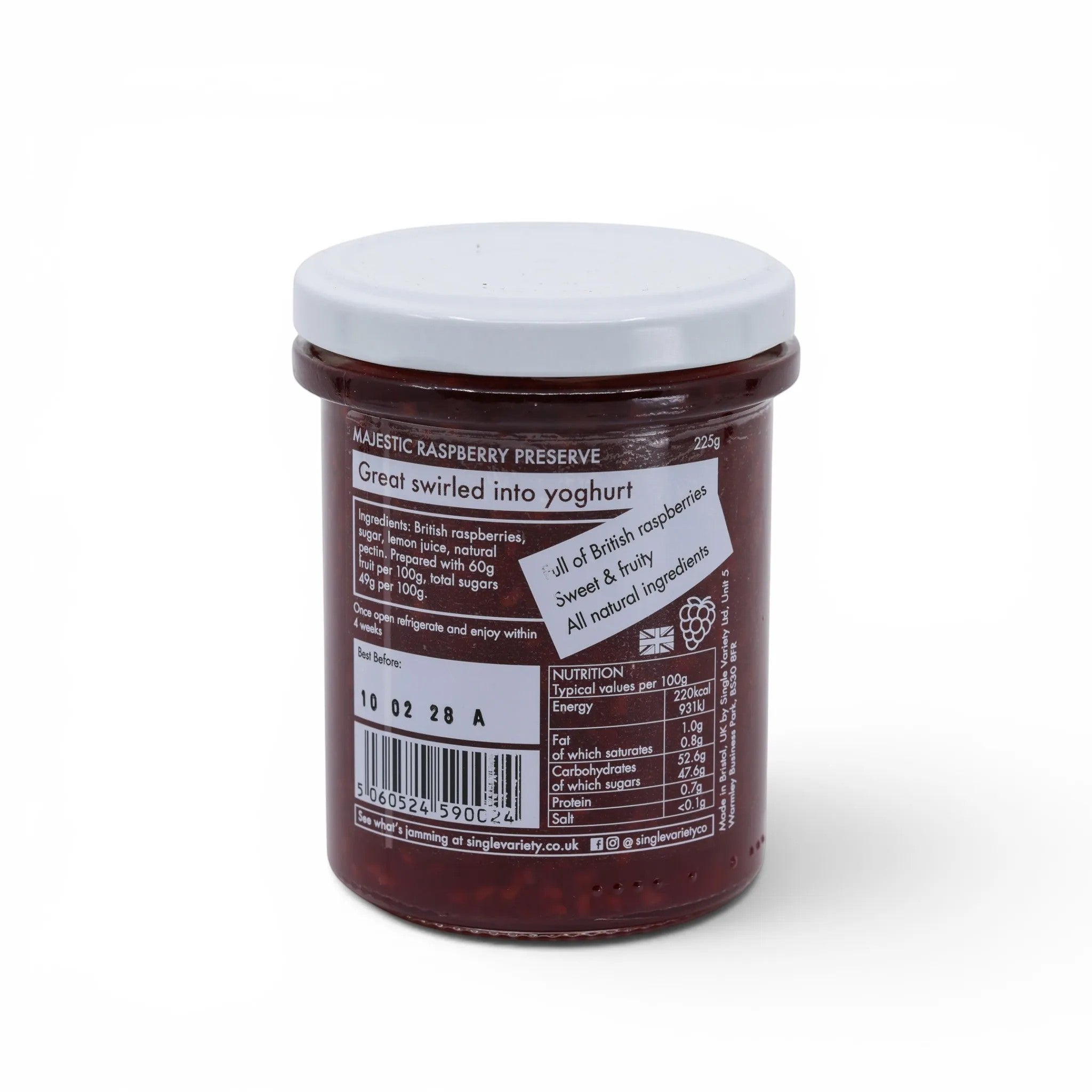 Made In England Majestic Raspberry Preserve jar with a white lid, showing the rich red preserve and label details.