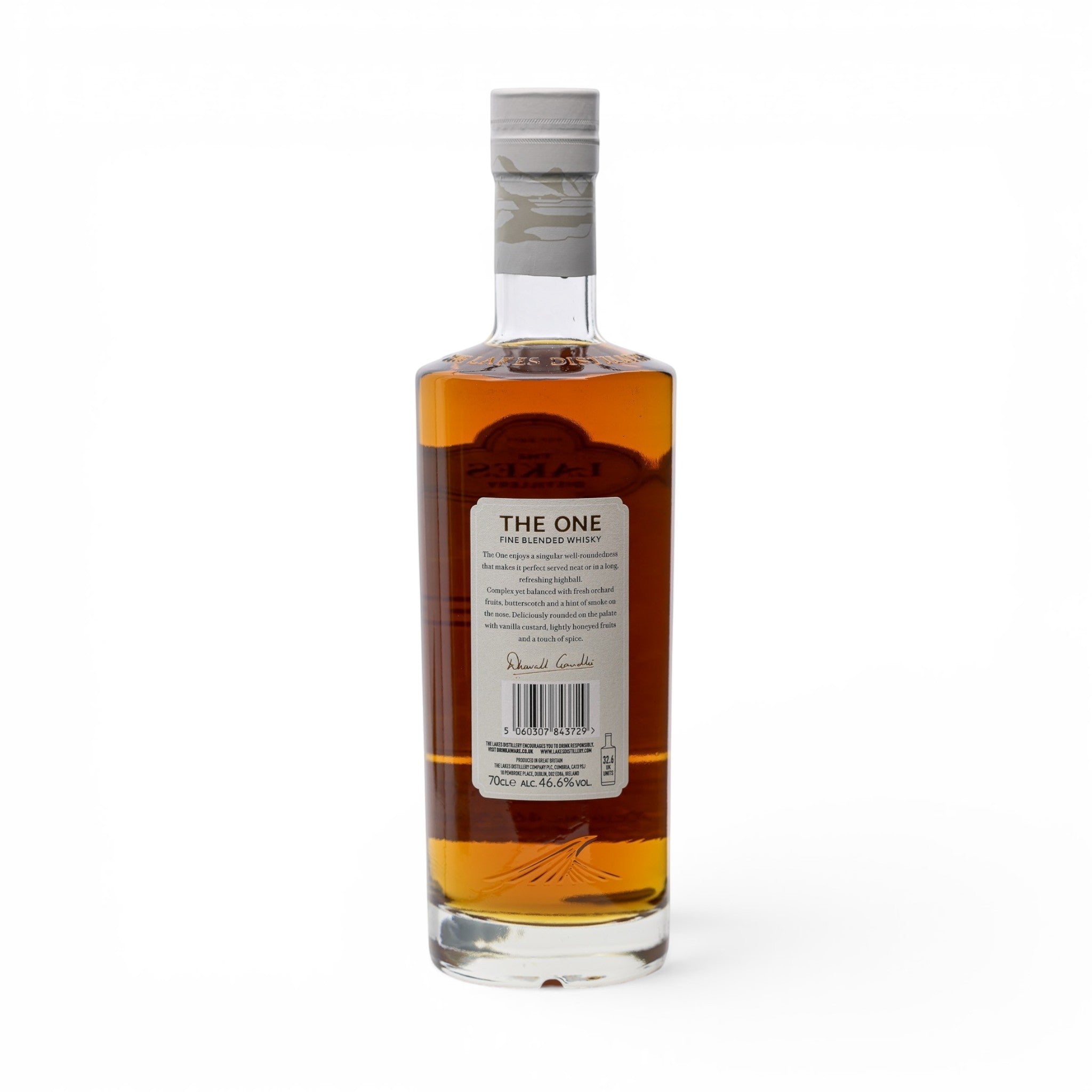 Made In England The One Fine Blended Whisky bottle with amber liquid, white label detailing tasting notes, and a grey patterned cap.