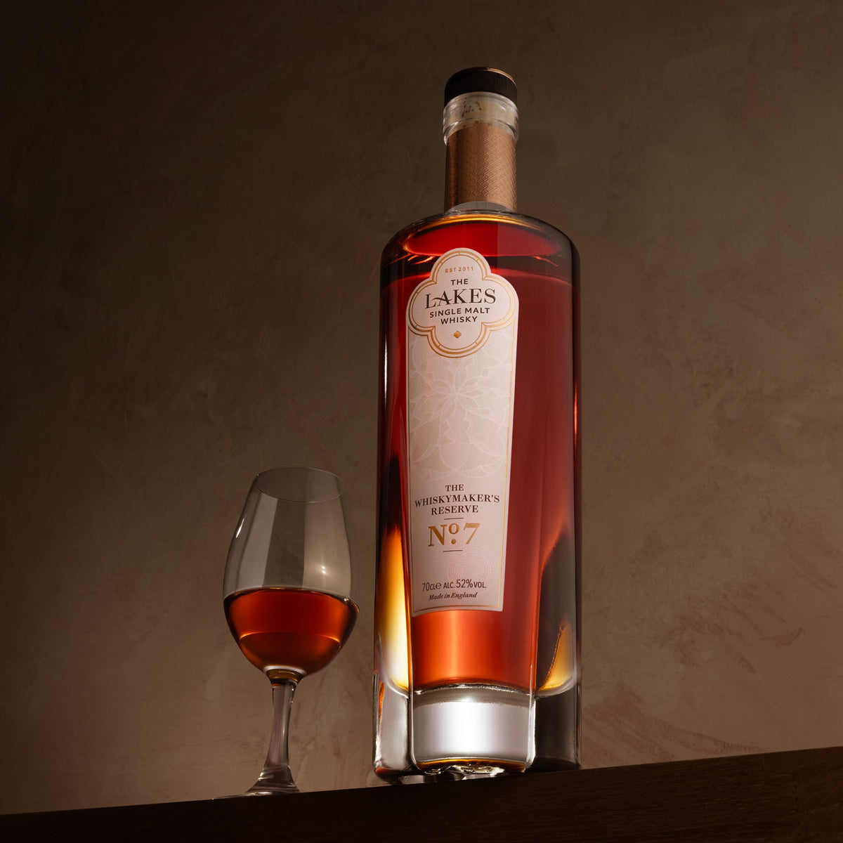 The Lakes Whiskymaker's Reserve No.7 bottle with a glass of whisky