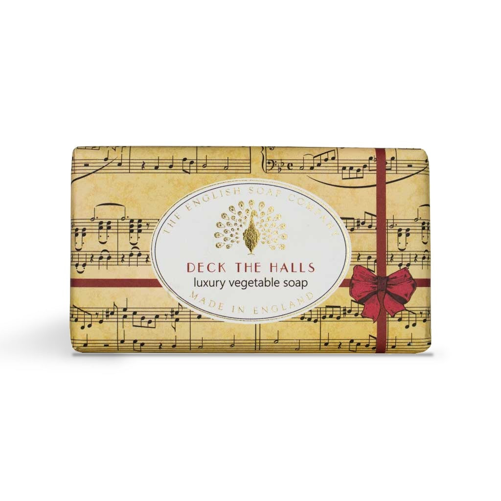 Deck the Halls soap bar in its sheet music wrapper with red ribbon