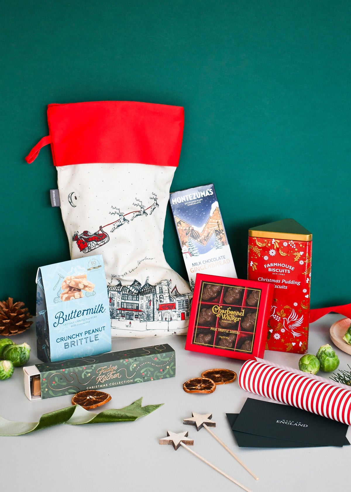 The Night Before Christmas Stocking and its contents against a dark green background