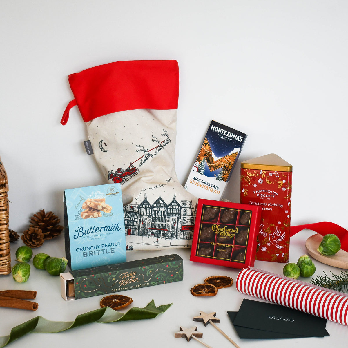 Pre-filled Christmas stocking with the Farmhouse Biscuits tin, Charbonnel et Walker Santas and Buttermilk peanut brittle