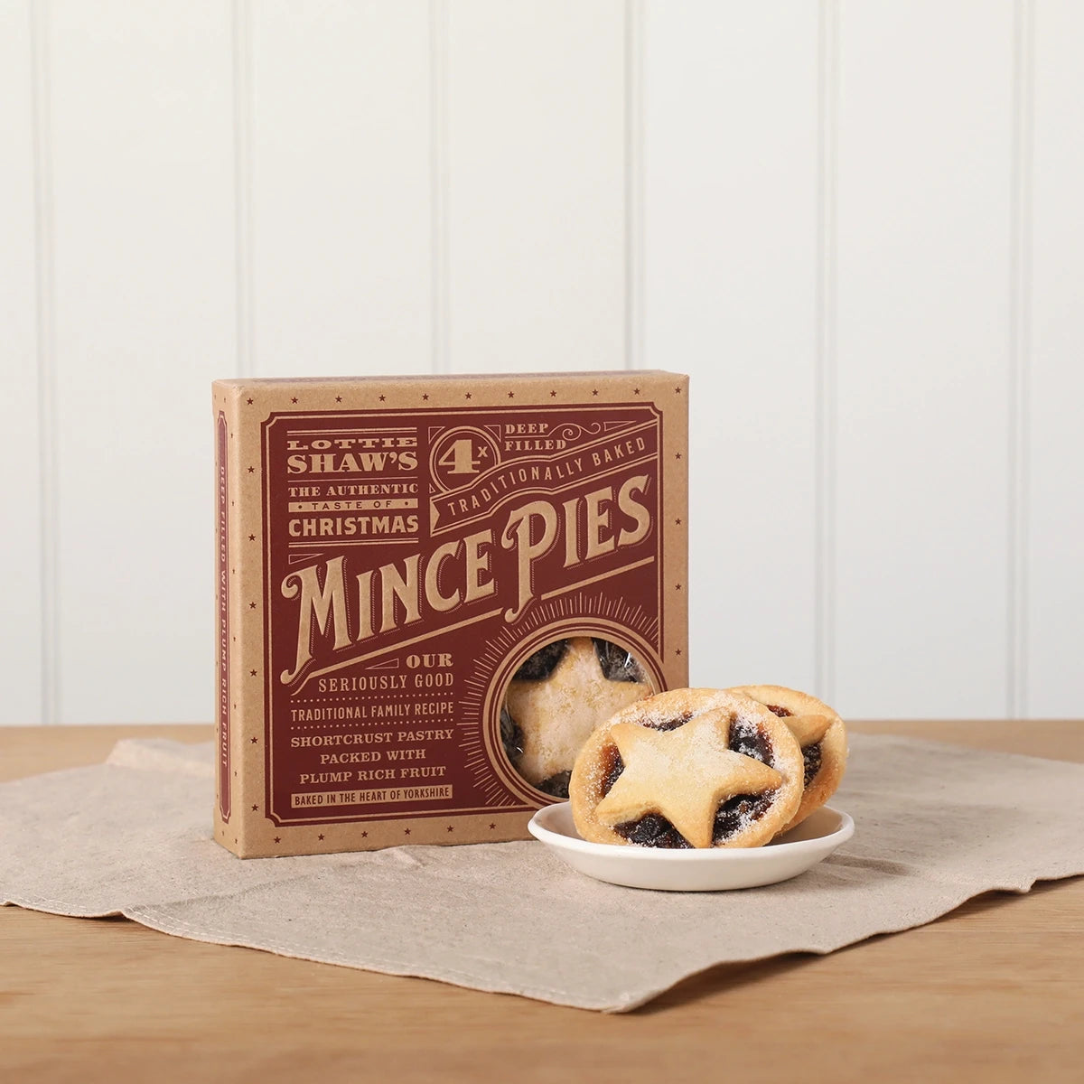 Box of four Lottie Shaw's deep filled mince pies with pastry stars
