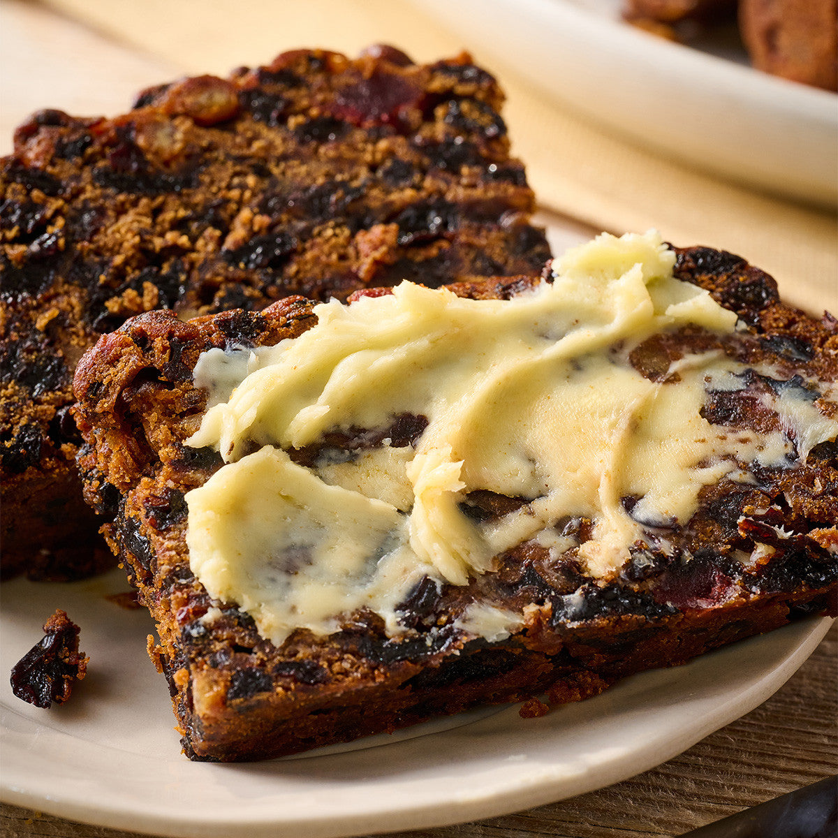 Sliced traditional fruit cake packed with fruit