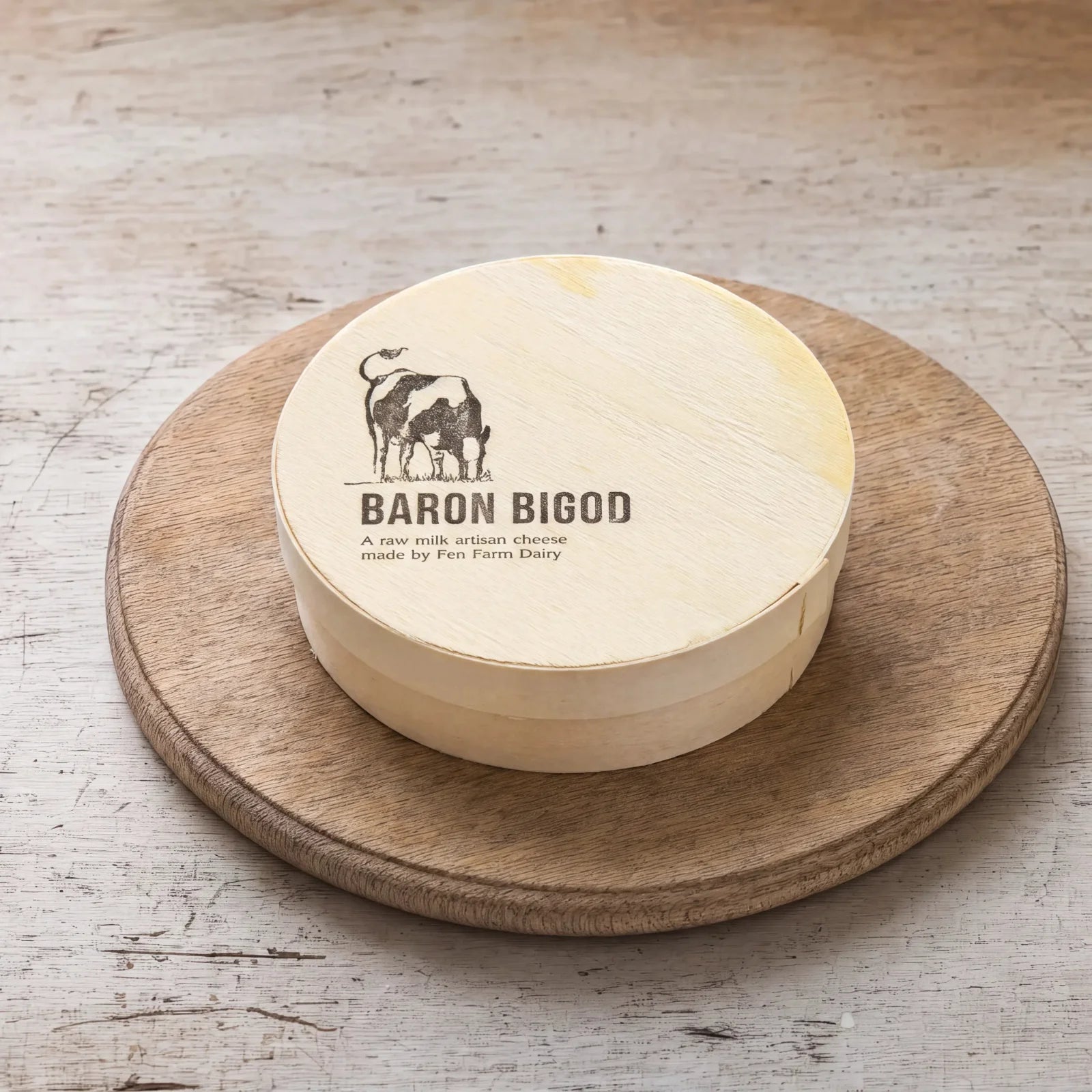 Baron Bigod in its wooden box on an oak board, English cheesemonger counter