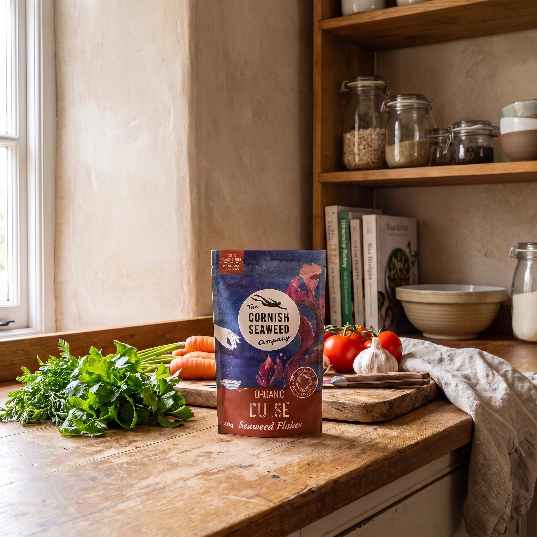 The Cornish Seaweed Company Organic Dulse Flakes pouch in a rustic kitchen setting