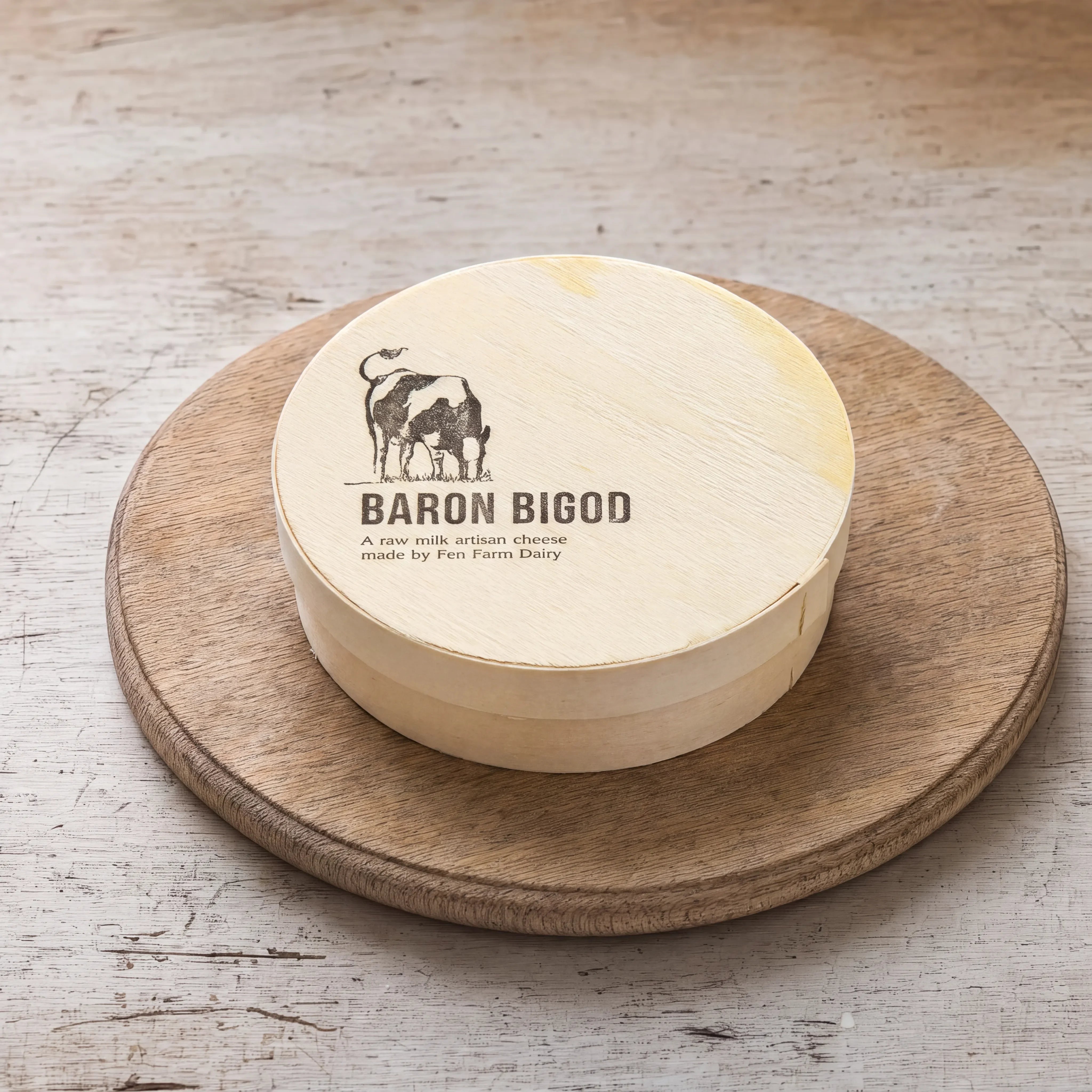 Baron Bigod in its wooden box on an oak board, English cheesemonger counter