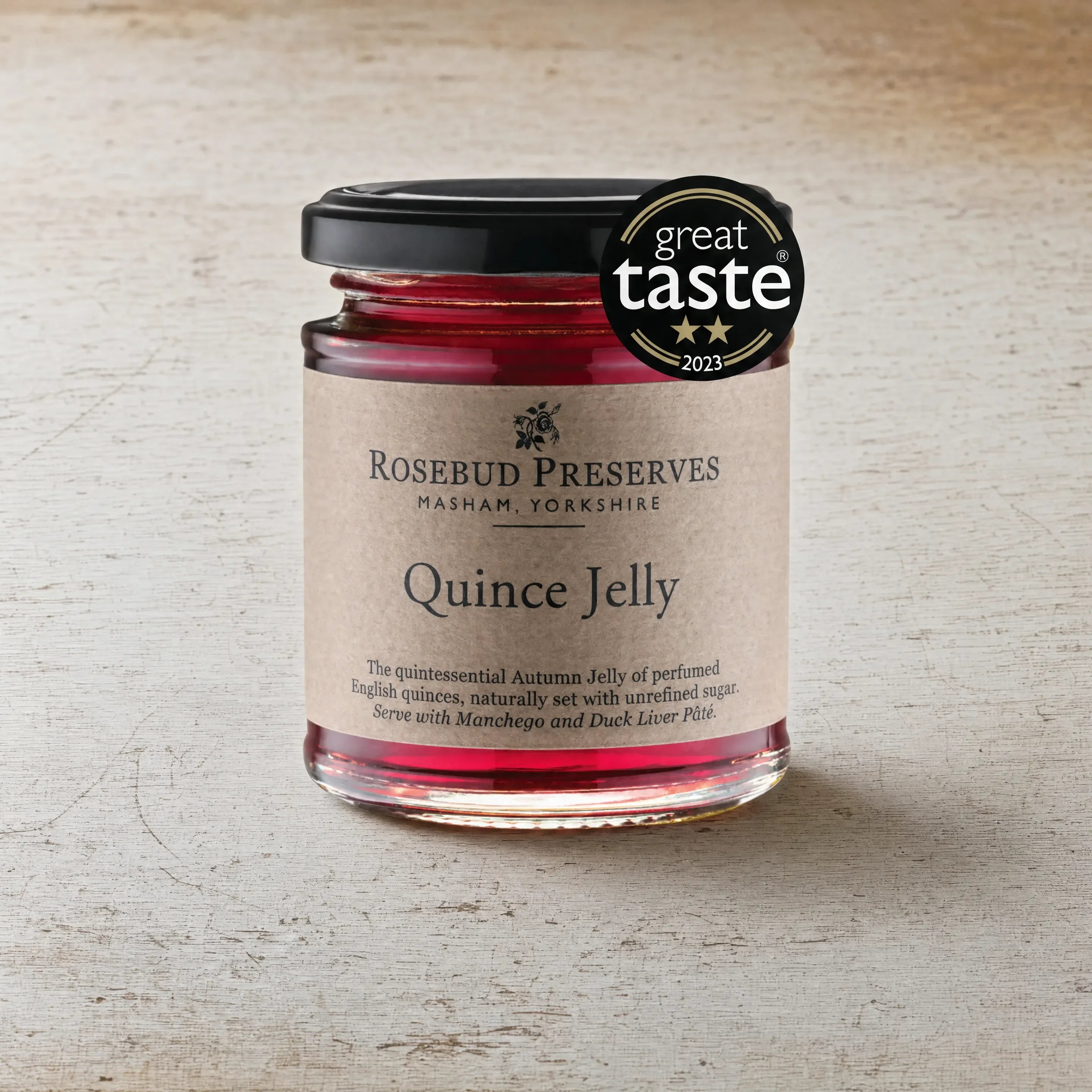 Rosebud Preserves Quince Jelly jar on an English cheesemonger counter