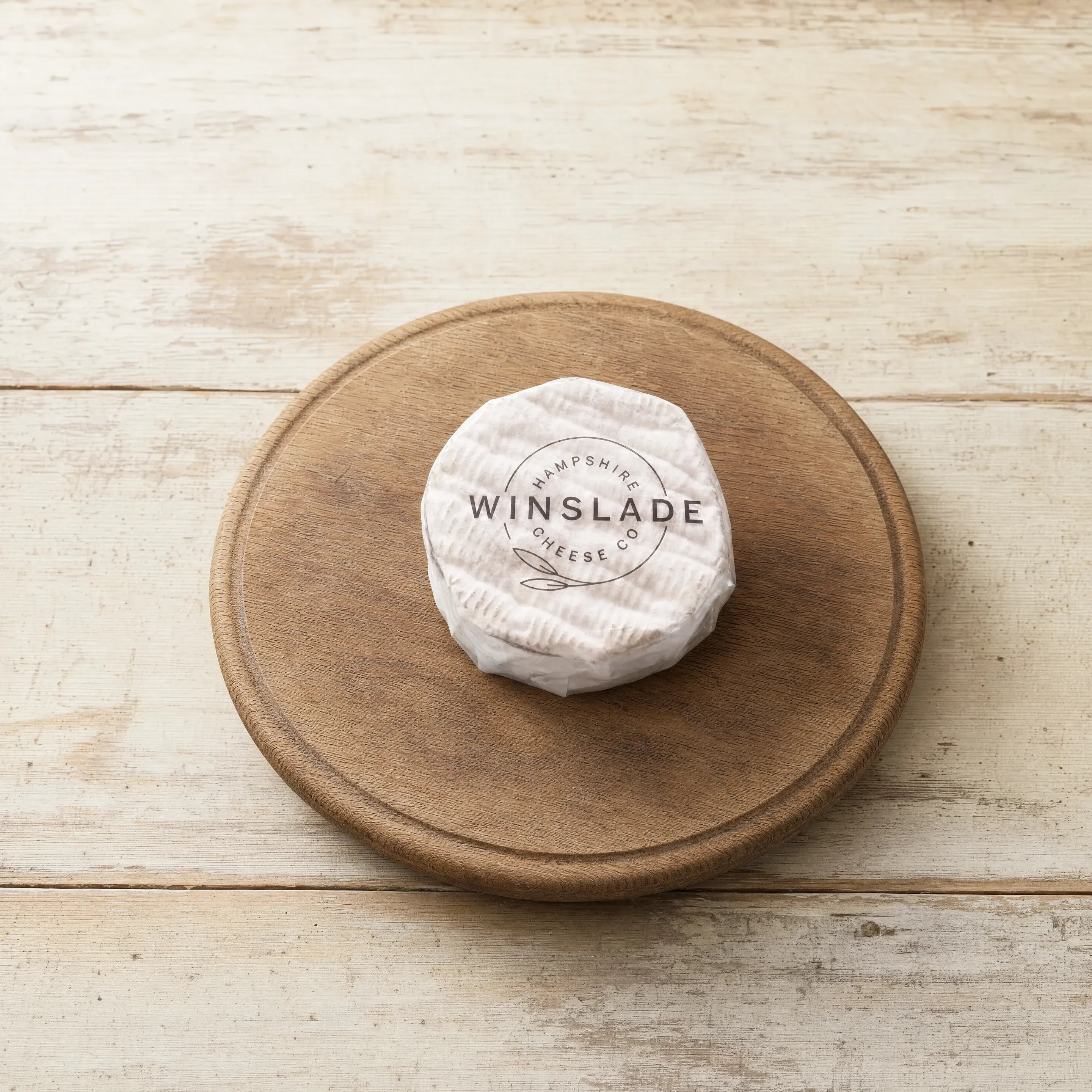 Winslade soft cheese on a cheese board, English cheesemonger counter