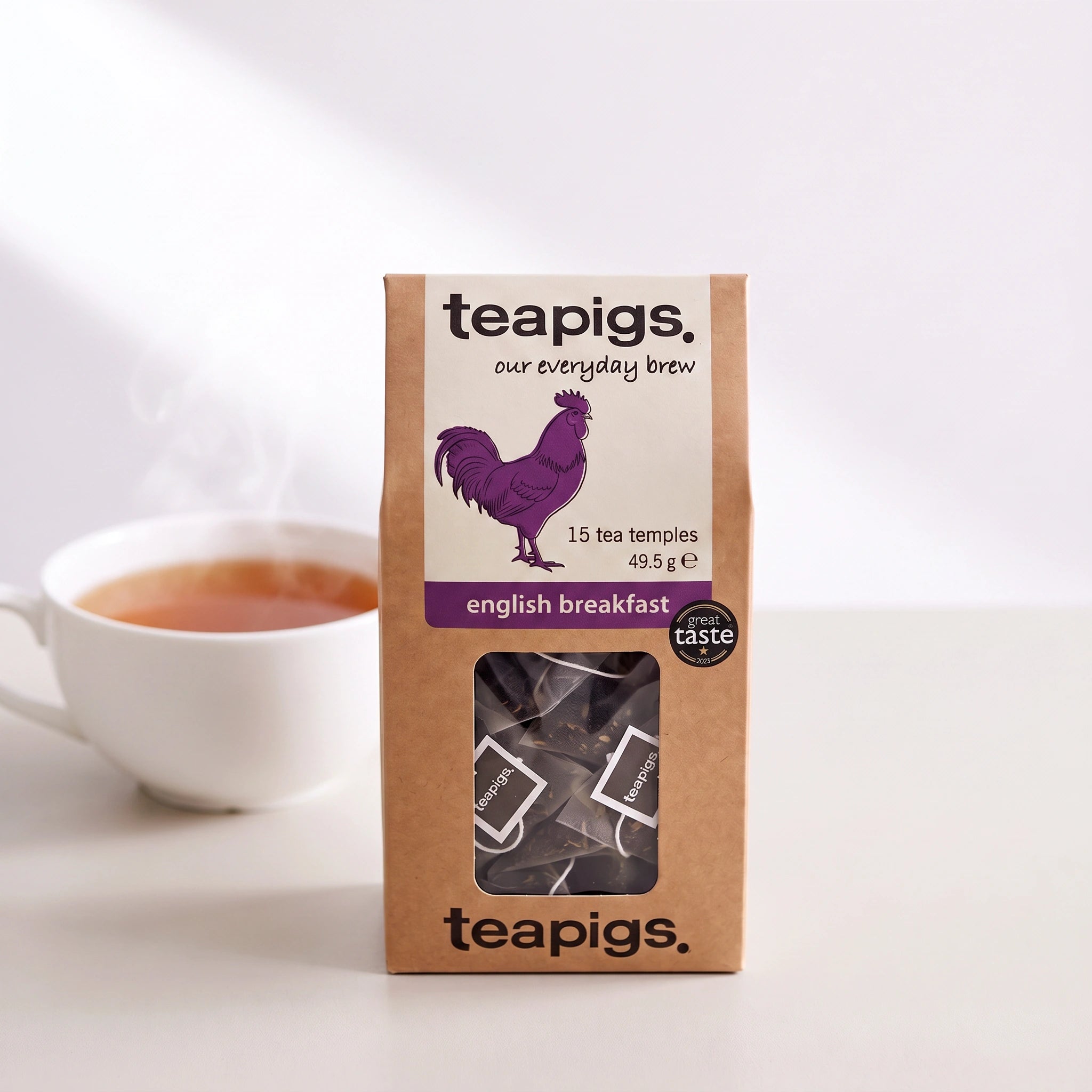 Teapigs English Breakfast tea temples box front-on with a cup of tea