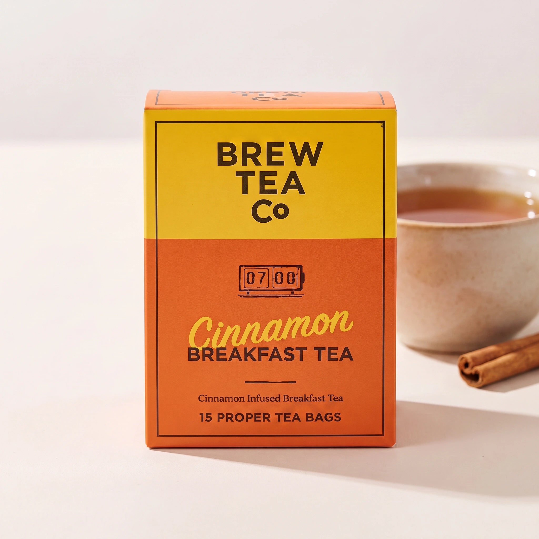 Brew Tea Co. Cinnamon Breakfast box front-on with a cup of spiced tea