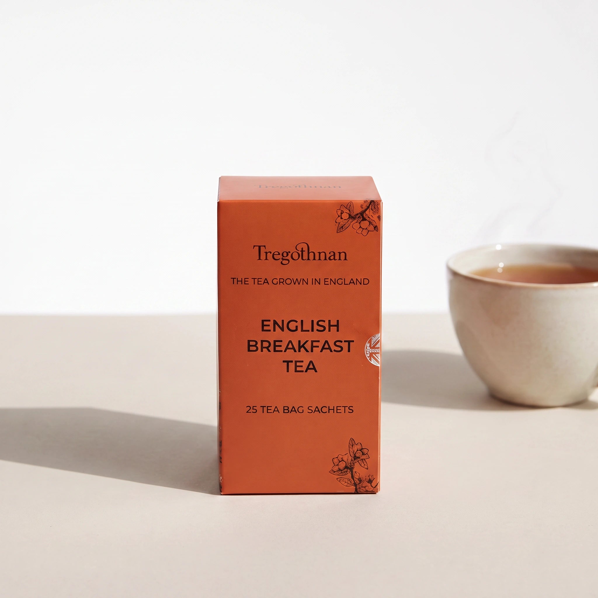 Tregothnan English Breakfast tea sachet box front-on with a cup of tea