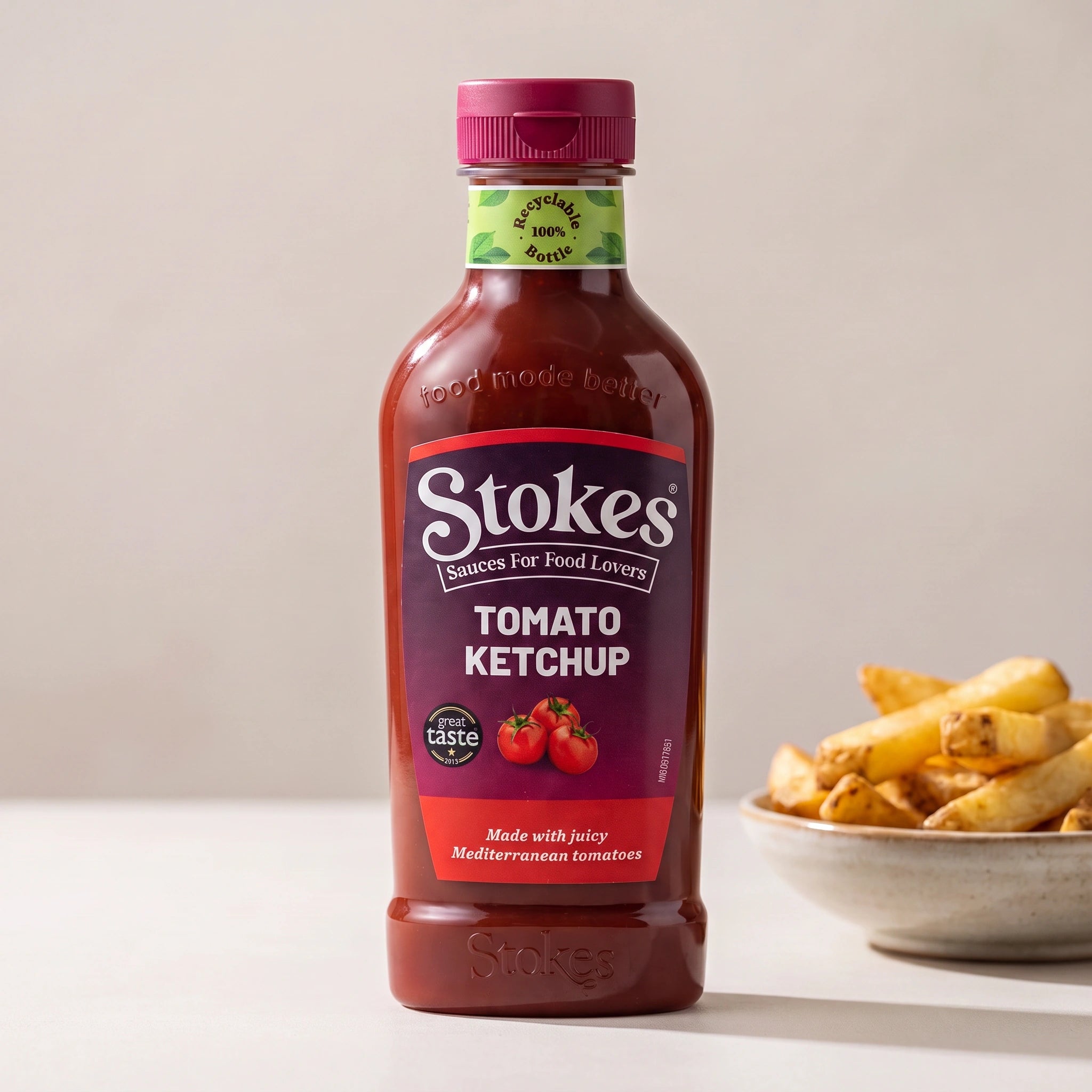 Stokes Real Tomato Ketchup bottle with a dish of chips
