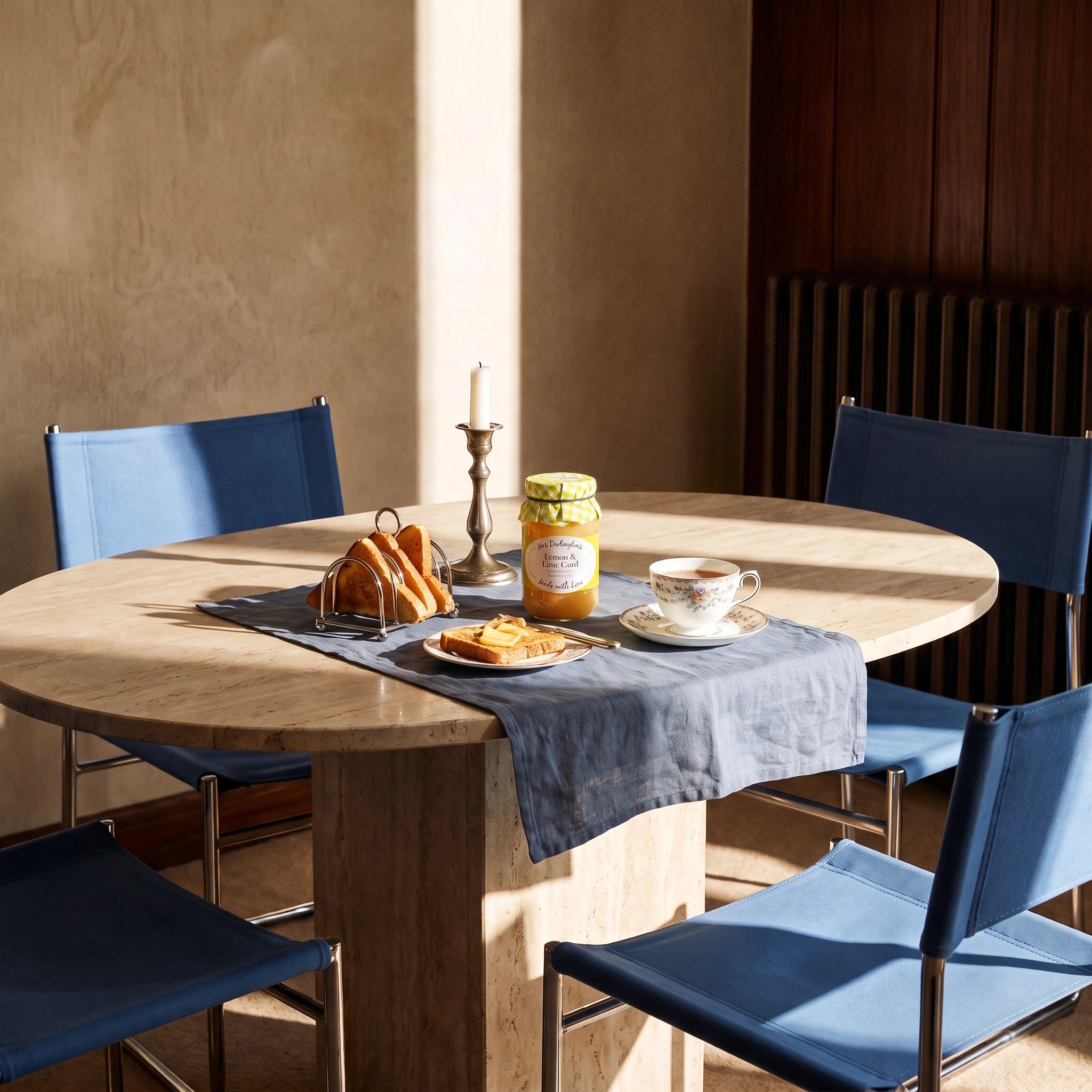 Mrs Darlington's Lemon & Lime Curd jar in a sunlit marble dining table breakfast setting with tea and toast