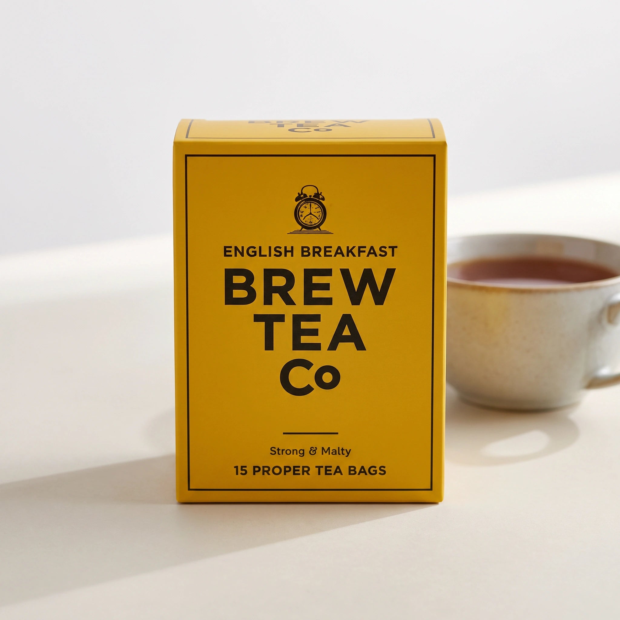 Brew Tea Co. English Breakfast box front-on with a cup of tea