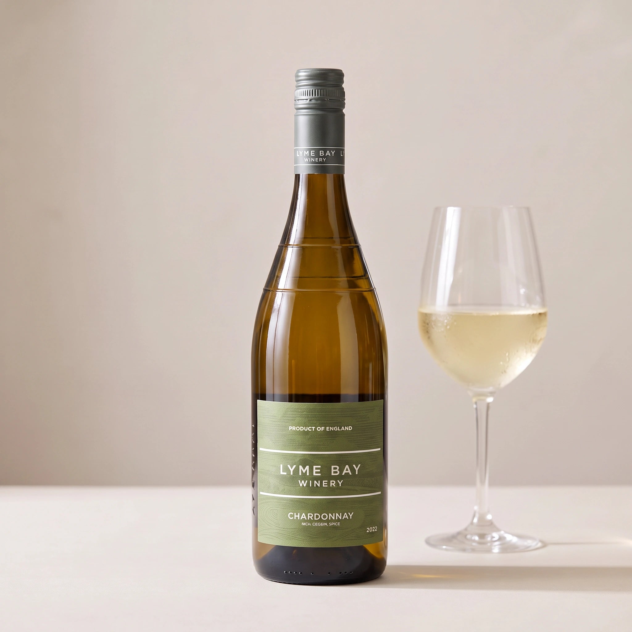 Lyme Bay Winery Chardonnay bottle with a glass of white wine