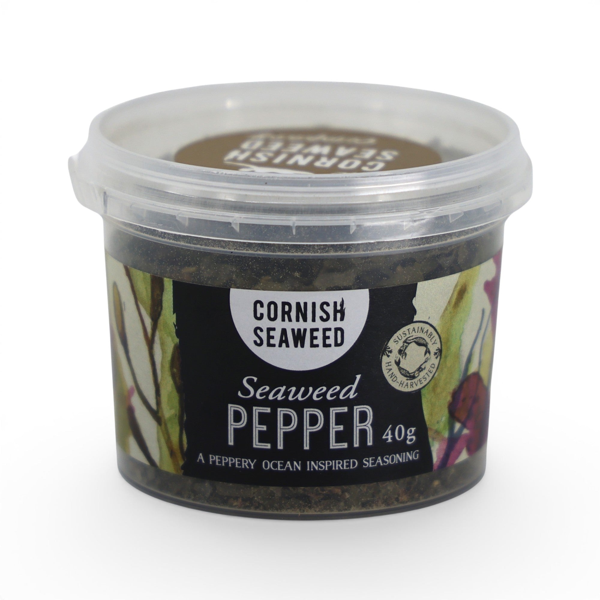 Made In England Cornish Seaweed Pepper seasoning in a clear plastic tub with a black label featuring watercolour seaweed illustrations.