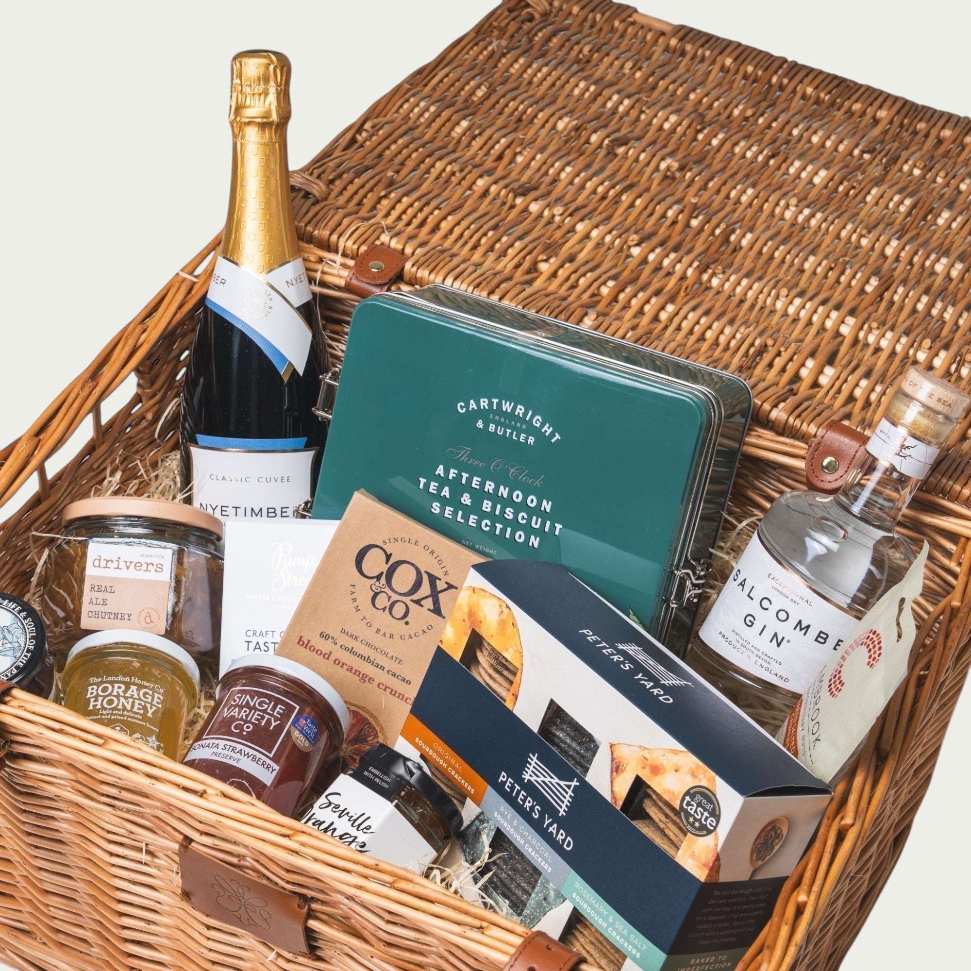 Made In England Luxury Afternoon Tea & Gin Hamper with Nyetimber sparkling wine, Salcombe Gin, biscuits, crackers, chutney, marmalade, and honey.