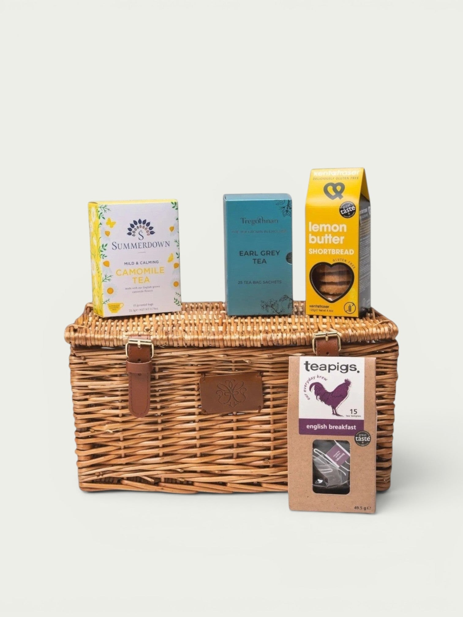 Made In England wicker hamper with Summerdown camomile tea, Tregothnan Earl Grey tea, teapigs English Breakfast tea, and lemon butter shortbread.